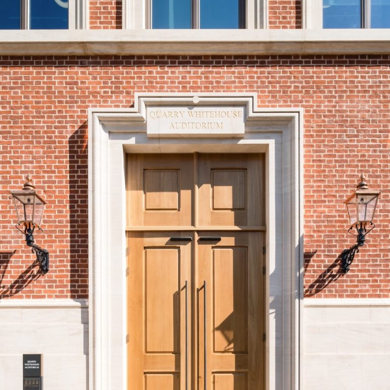 Natural limestone plinth and architrave