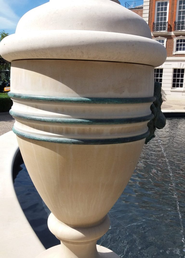 Portland stone urn with bronze detailing