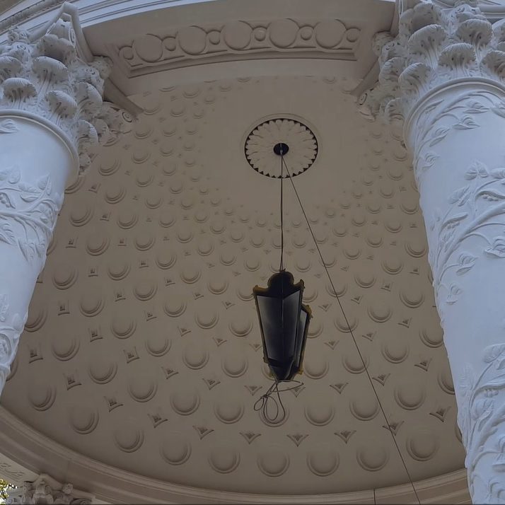 Carved capitals below coffered dome