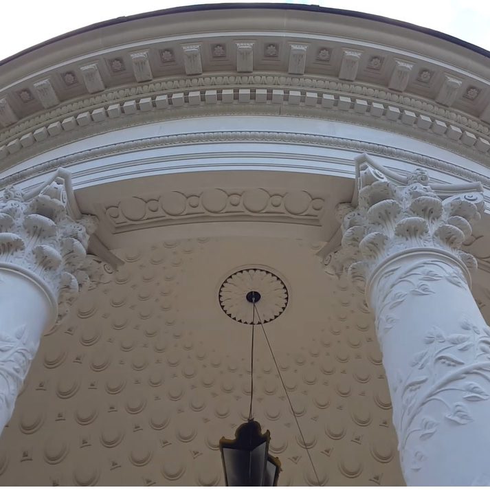 Stone entablature with echinus moulding, dentils and carved modillions